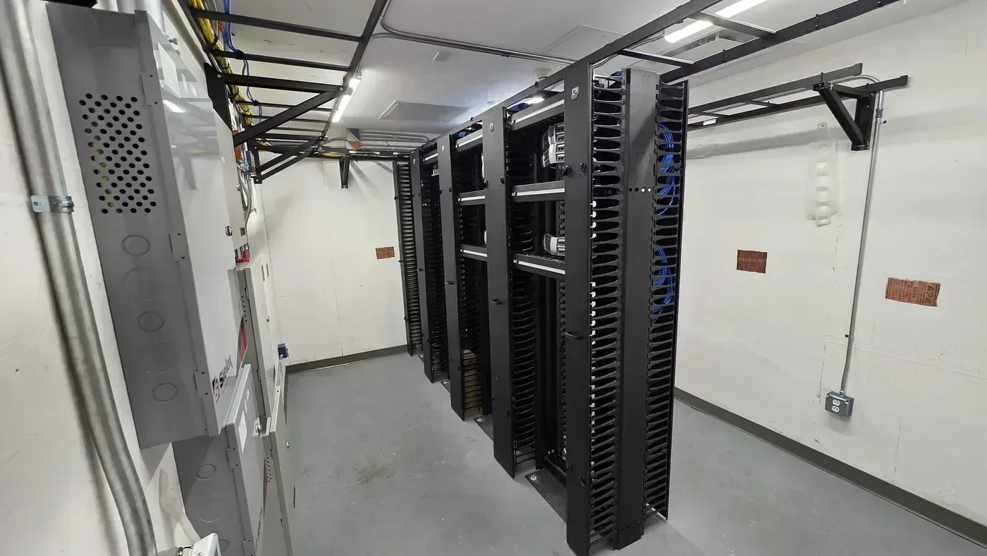 Hospital pharmacy TDR server room buildout with racks and cable managers