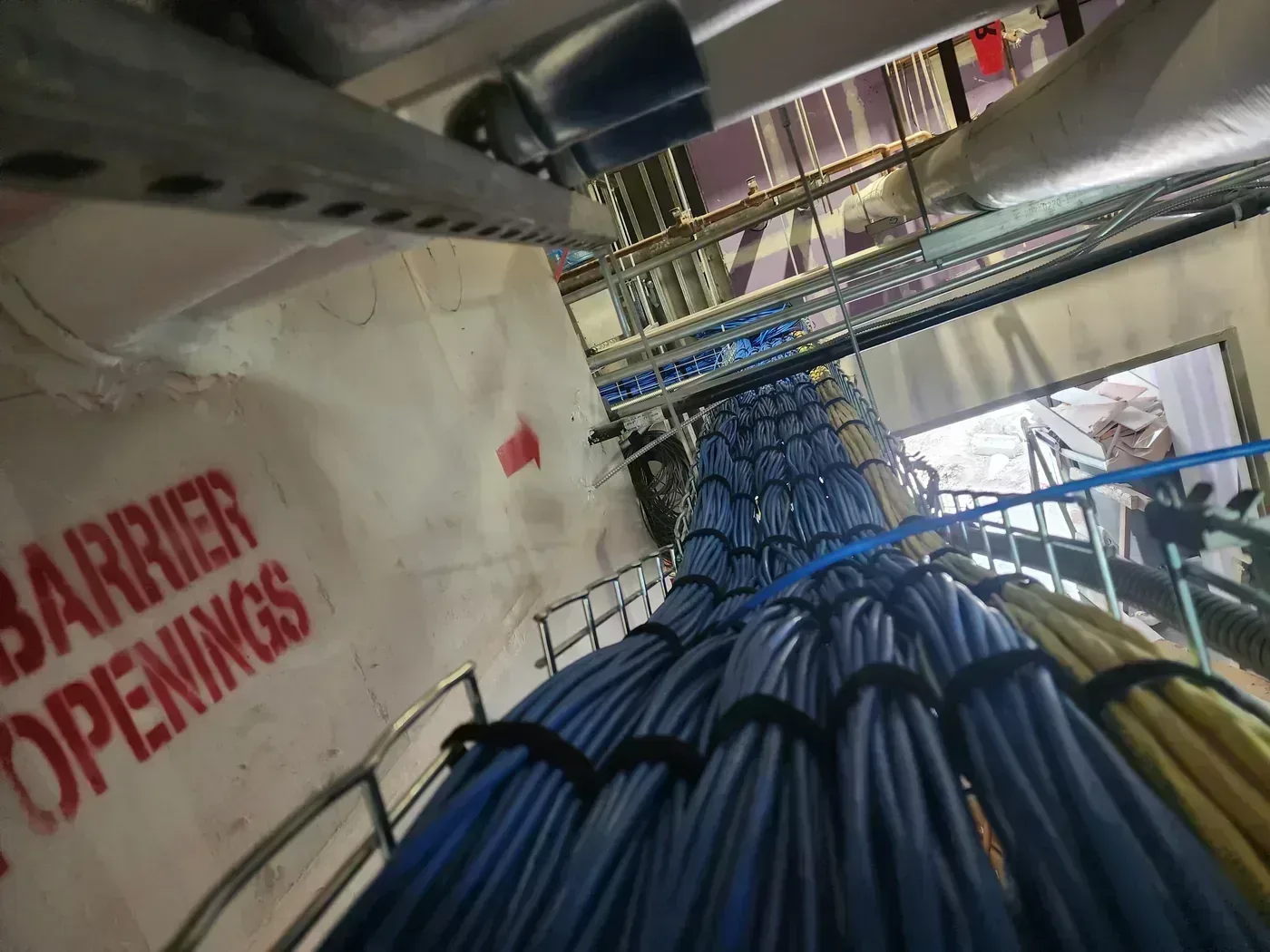 CommScope Systimax structured cabling routed through cable tray above ceiling