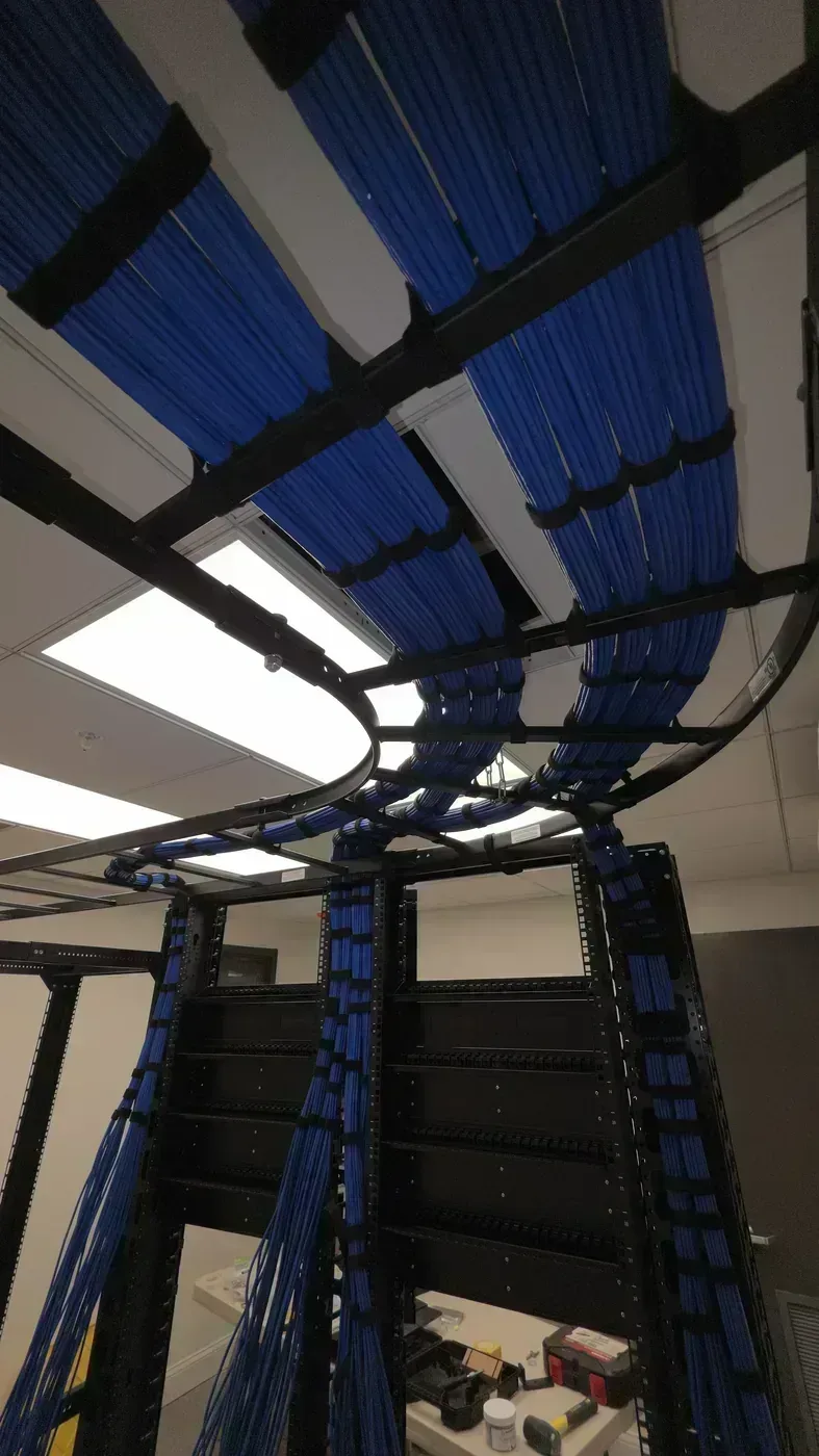 Cat6 cable combing before termination in manufacturing office buildout