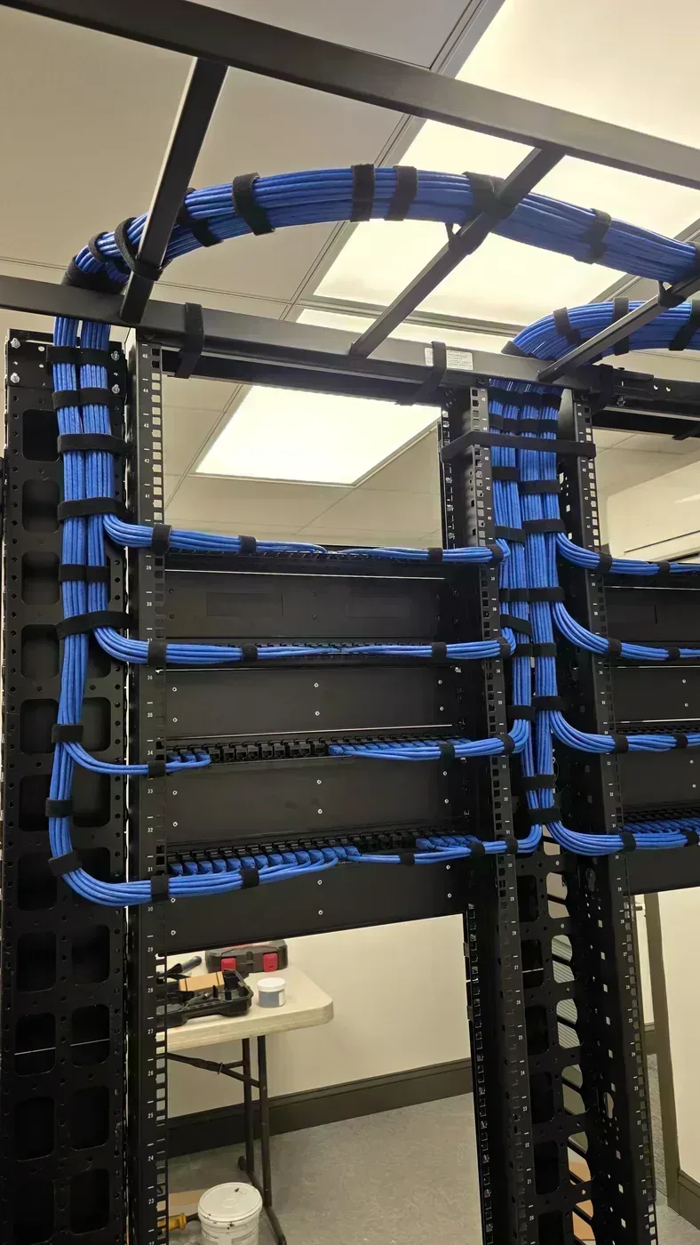 Cat6 cable routing on ladder rack in metals manufacturing facility