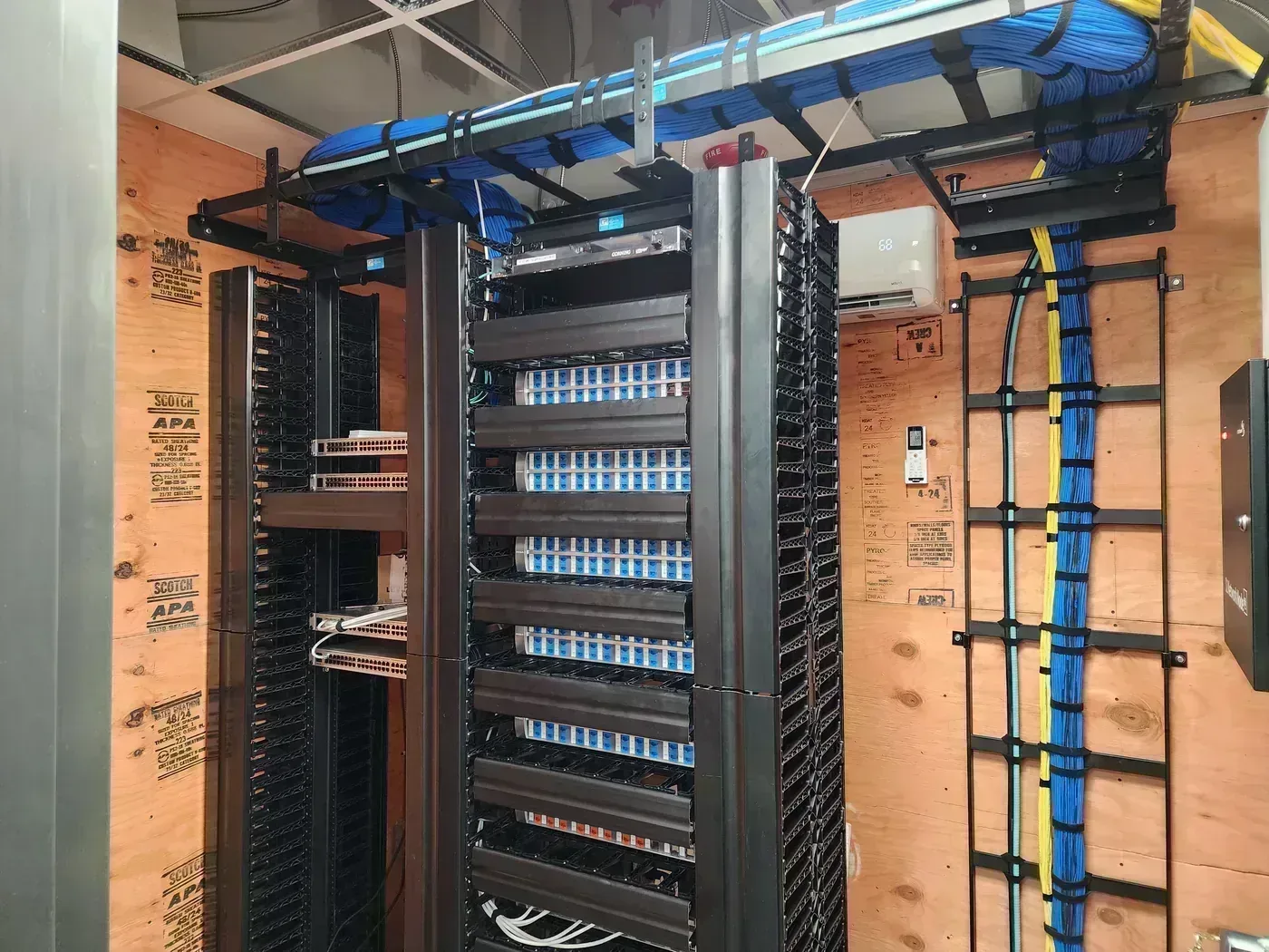Color-coded Cat6 patch panel inserts in private school expansion TDR