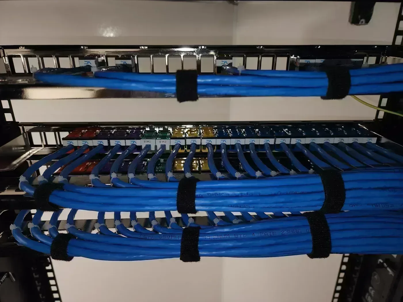 Cat6A patch panel terminations with color-coded inserts in restaurant TDR